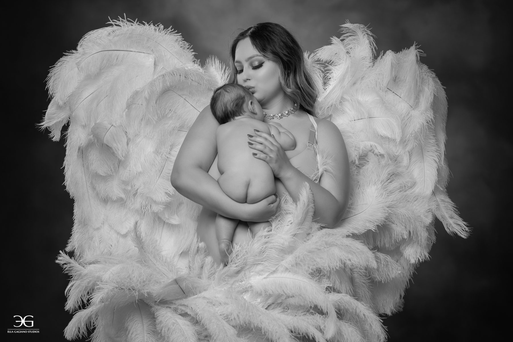 newborn photoshoot mother in angel wings boudoir photoshoot