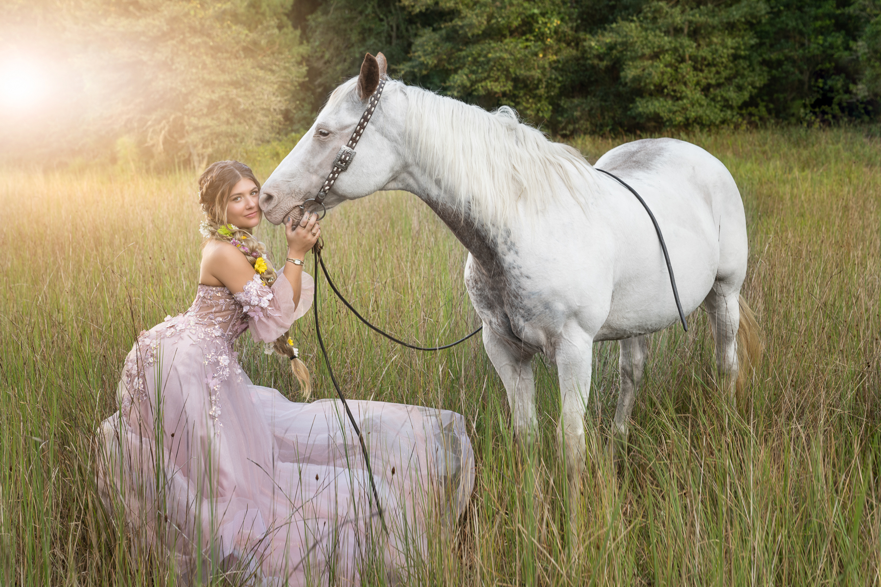 Glamour Photoshoot with woman in beautiful pink ballgown and horse in a field