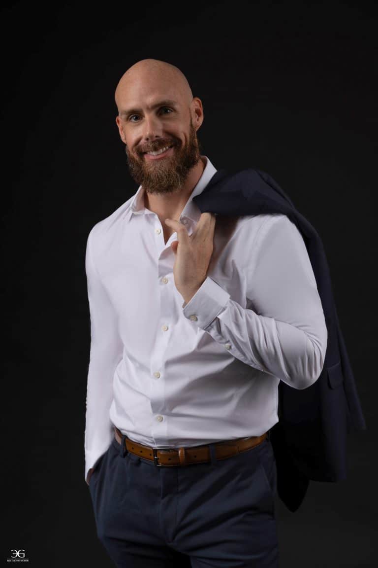 Men's portrait photography in Lexington KY featuring a man in a white shirt and navy suit